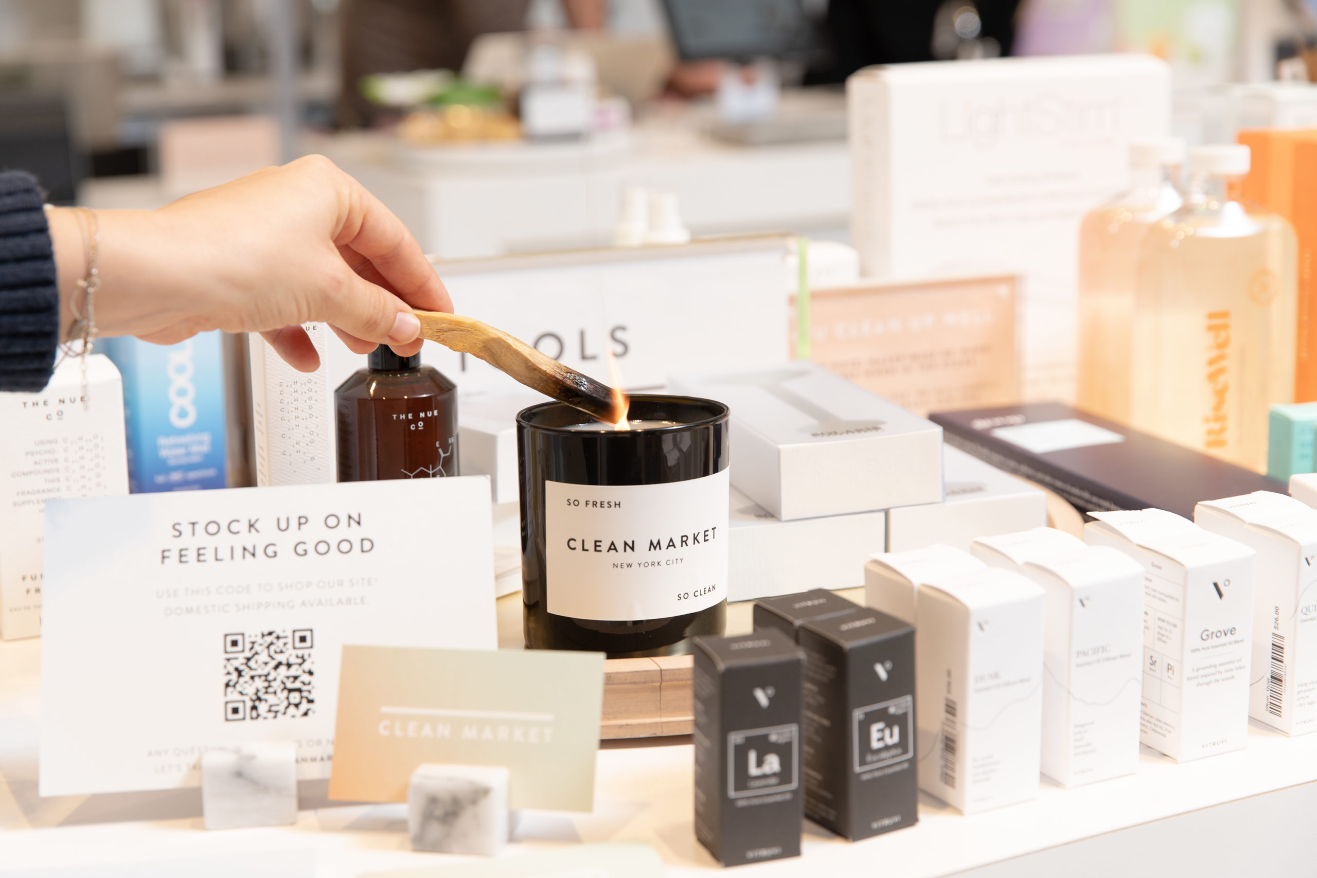 Clean Market candle among beauty products