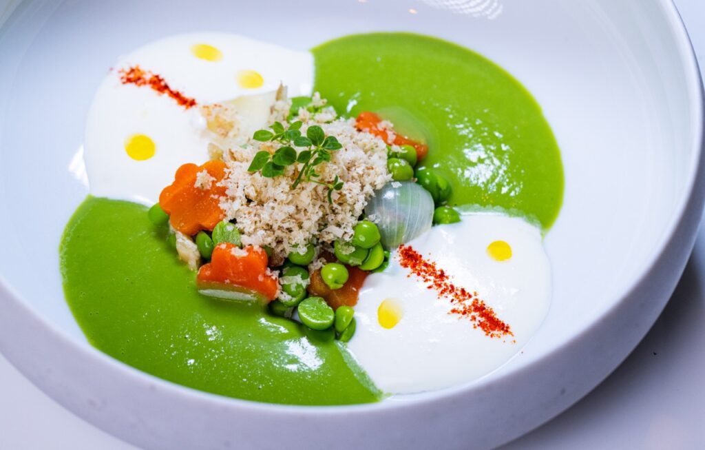 English pea velouté with ricotta mousse, mint, and walnuts 